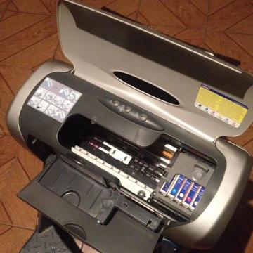 impresora epson R220 vendoo o cambio por perolito movistar